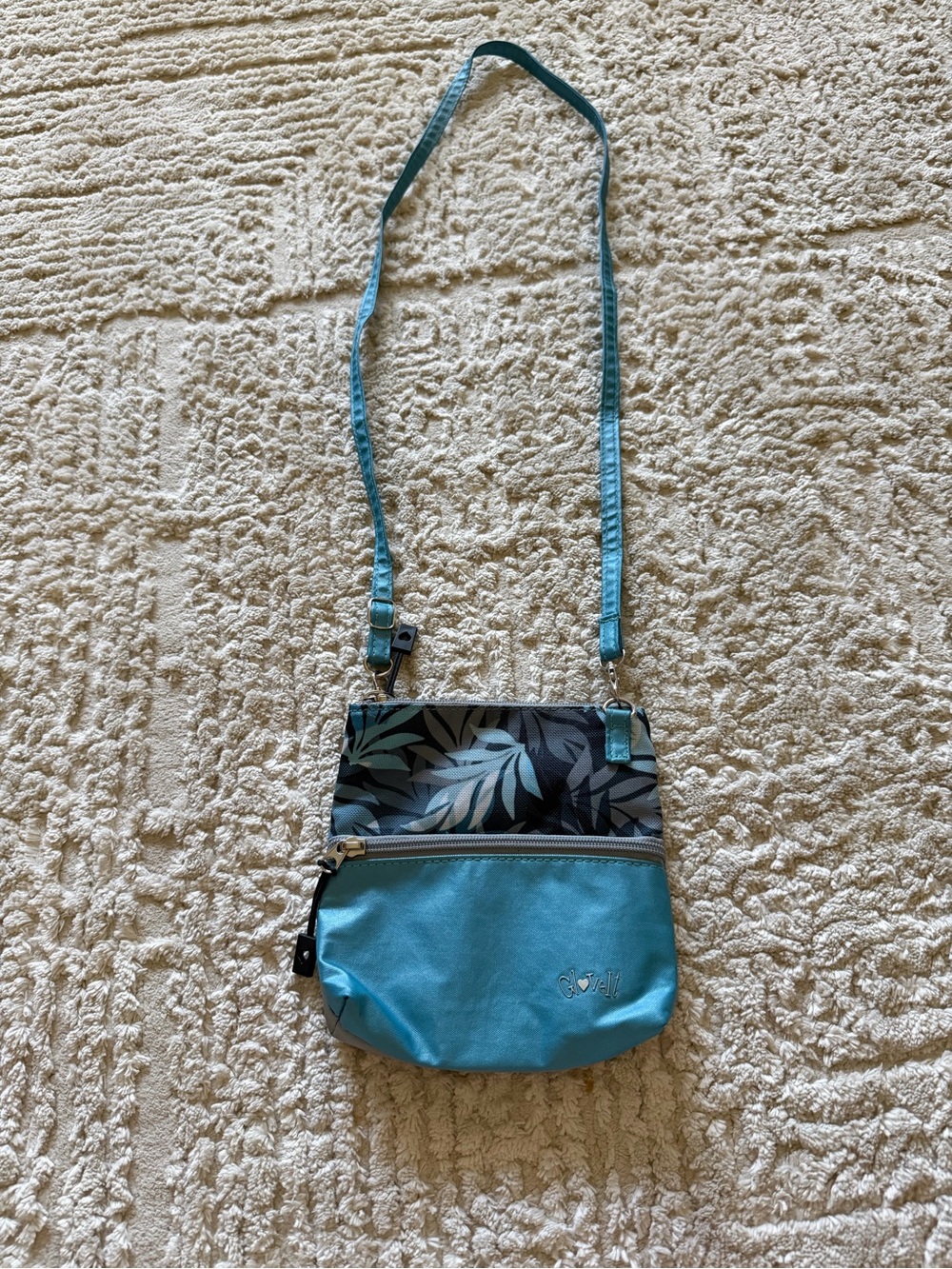Turquoise Crossbody Bag with Leaf Print Panel by Glove It